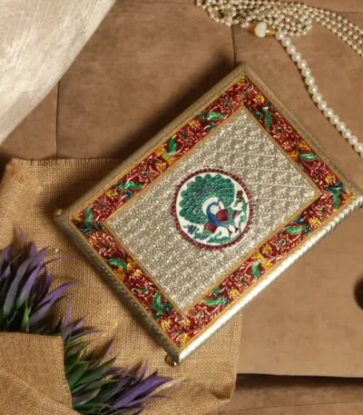 Silver embossed paata with metal legs