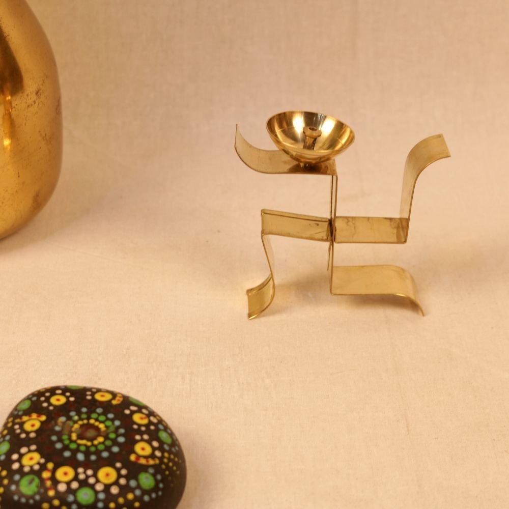 Golden Iron Swastik Diya β Traditional Pooja Candle Holder for Home & Festive Decor